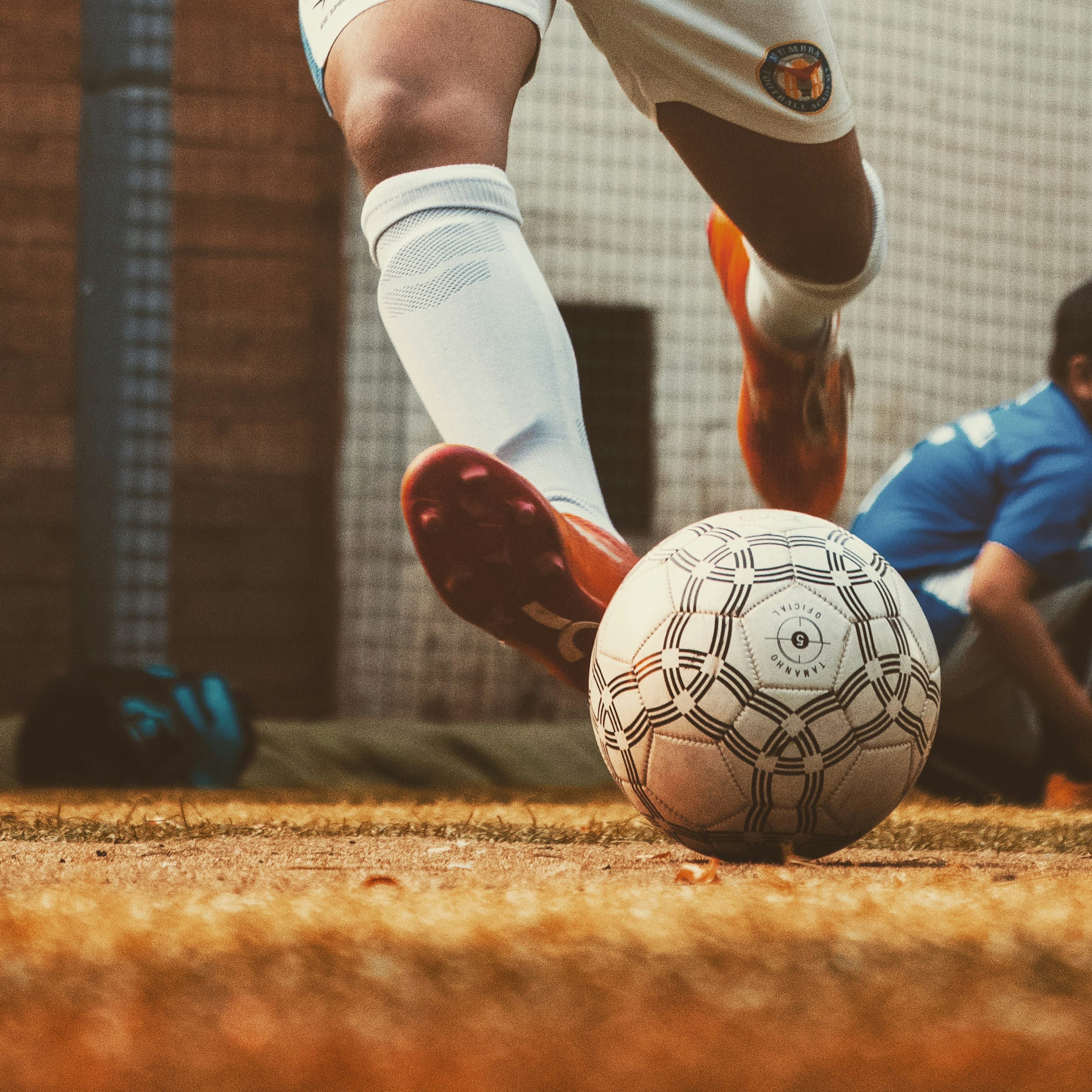 Player controlling a soccer ball at their feet